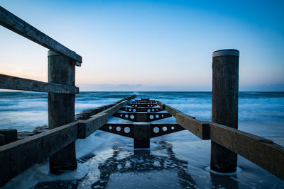 Scenic view of sea against sky during winter