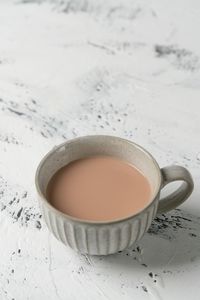 High angle view of coffee cup on table