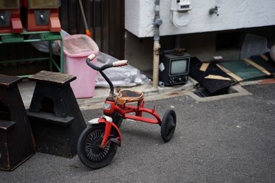 Toy car on street against buildings in city