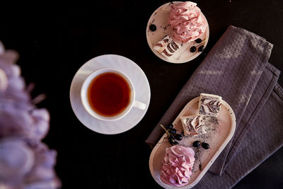 Natural dessert - sugar and gluten free marshmallows with currant and cup of tea. autumn  appetizer.