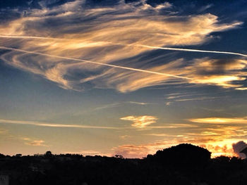 Scenic view of landscape against sky at sunset