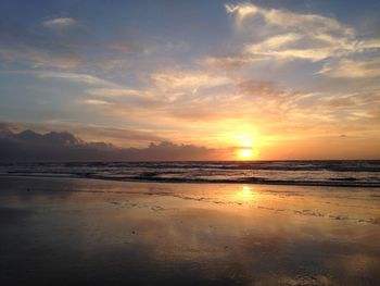 Scenic view of beach against sky during sunset