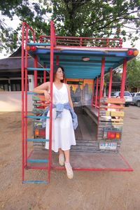 Full length portrait of smiling woman
