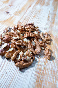 Walnut halves on wooden background