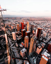 Aerial view of cityscape against sky during sunset