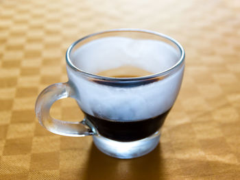 Close-up of coffee cup on table