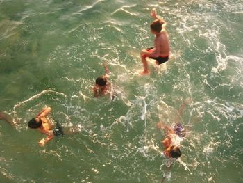 People swimming in sea