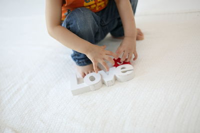 Midsection of man playing with toy