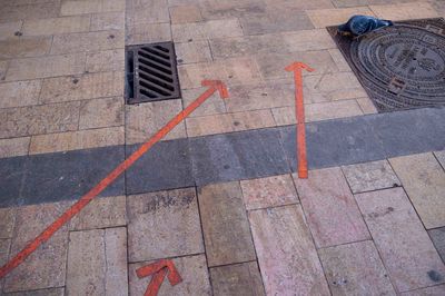 High angle view of arrow symbol on street