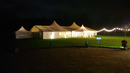 View of tent on field against sky at night