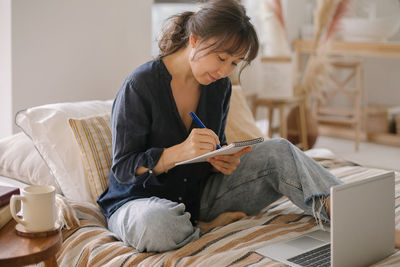 Woman preparing strategy while working at home