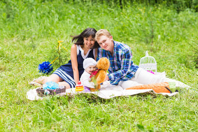 Two women sitting on grass