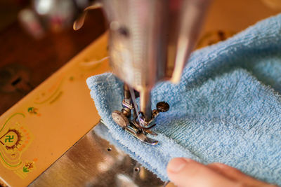 Close-up of person working on leaf