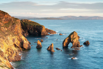 Scenic view of and rock formations against sky