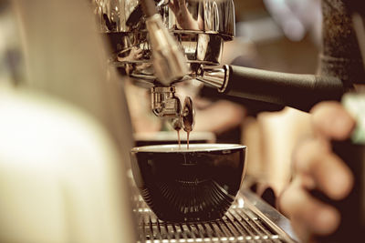 Close-up of pouring coffee in cup