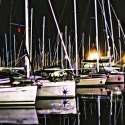 Boats moored at harbor