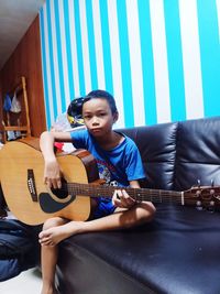 Young man playing guitar