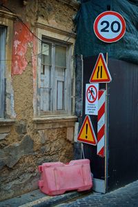 Road sign on old building