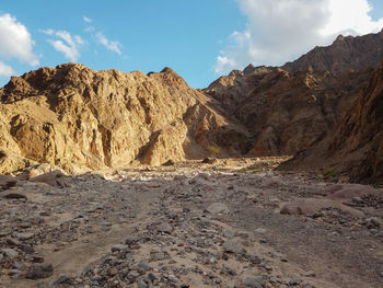 Panoramic view of arid landscape against sky