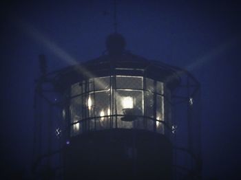 Low angle view of illuminated building at night