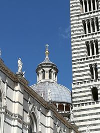 Low angle view of building against blue sky