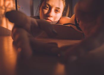 Portrait of a young girl reaching for the camera 