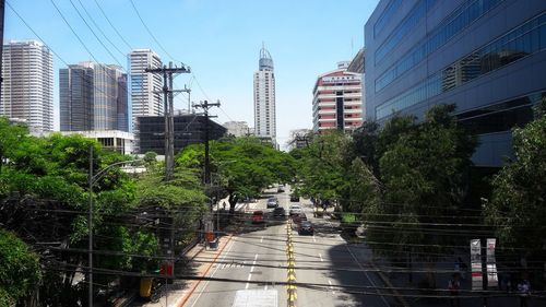 City street and buildings against sky