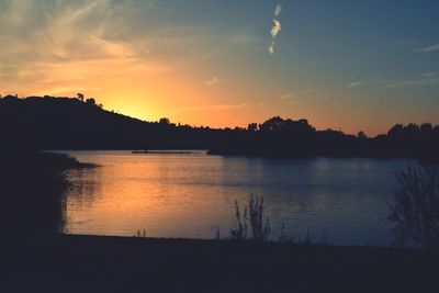 Scenic view of sunset over lake