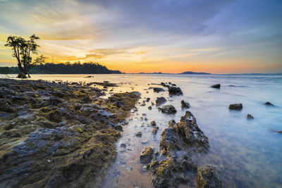 Scenic view of sea against sky during sunset