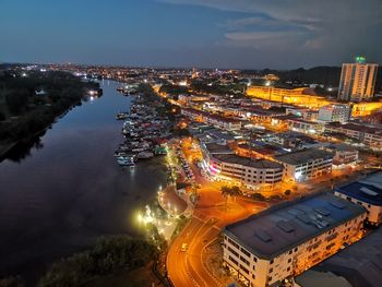 High angle view of illuminated city buildings at night