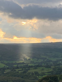 Scenic view of land against sky during sunset