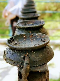 Close-up of rusty stack of iron cast for lighting fire for worshipping 