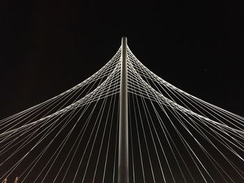 Low angle view of suspension bridge against clear sky