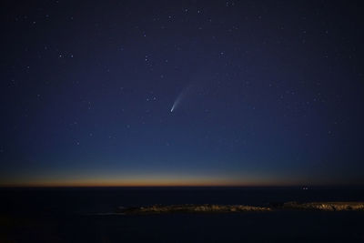 Comet neowise over the night sky of the galician coast