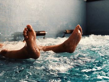 Low section of man in swimming pool