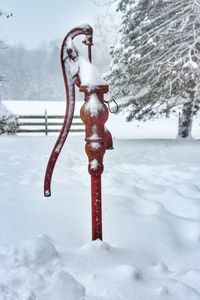 Water pump on snow covered field