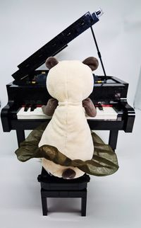 Rear view of figurine sitting on table