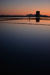 Scenic view of sea against clear sky during sunset