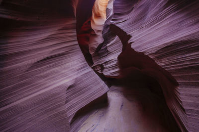 Low section of man standing on rock