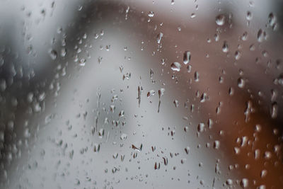 Full frame shot of wet glass window