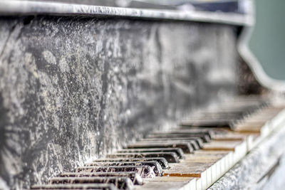 Close-up of abandoned piano