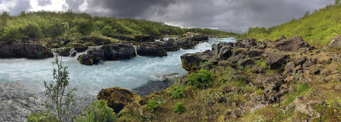 Panoramic view of rocks against sky