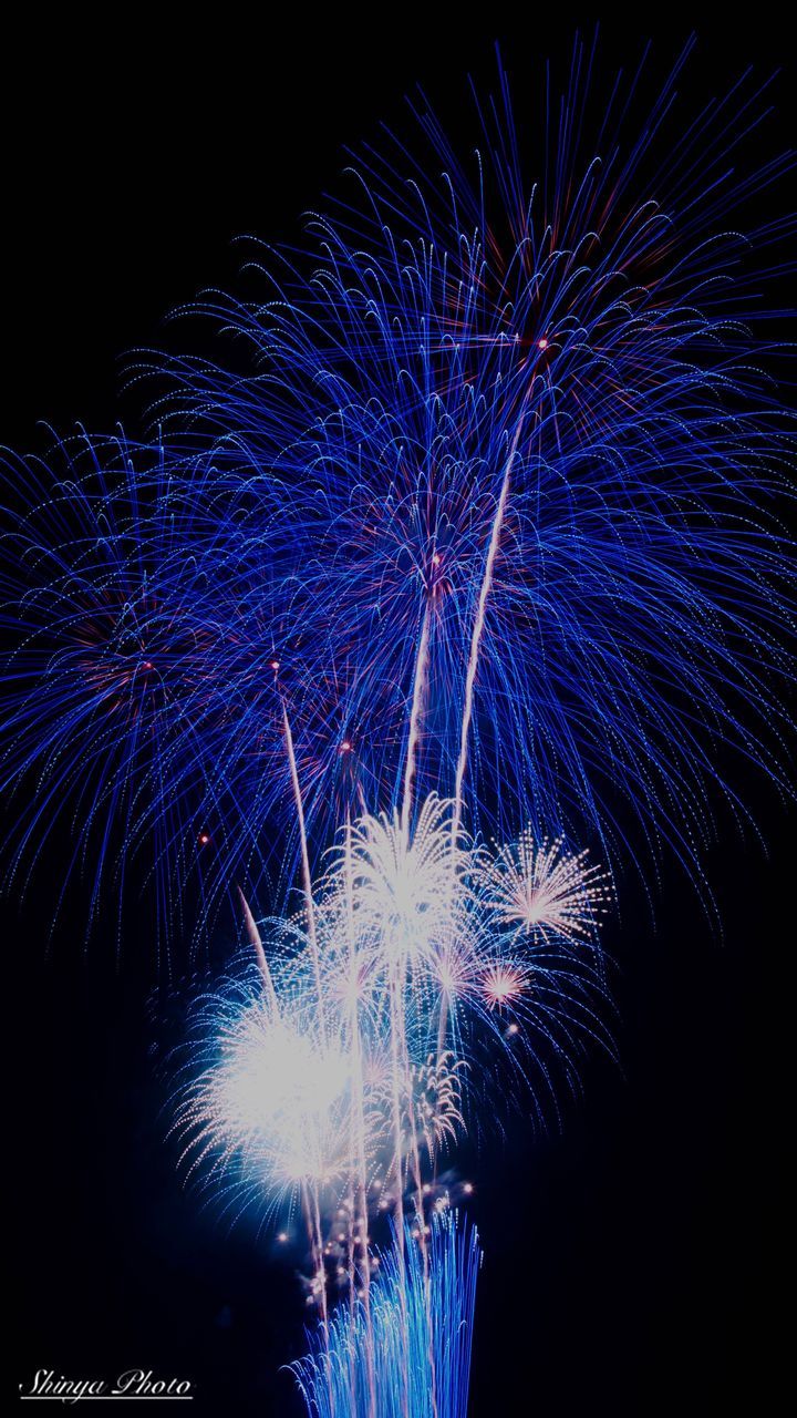 celebration, firework display, night, exploding, arts culture and entertainment, event, low angle view, firework - man made object, long exposure, multi colored, illuminated, blurred motion, blue, motion, no people, firework, sky, outdoors