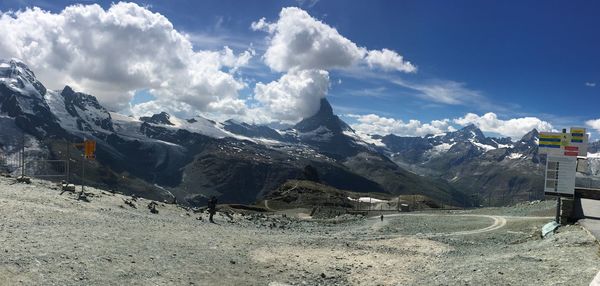 Panoramic view of snowcapped mountains against sky