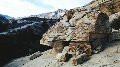 Rocks on mountain against sky