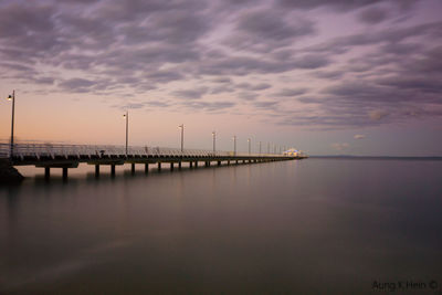 Scenic view of calm sea at sunset