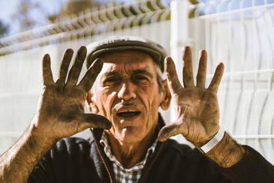 Close-up of senior man gesturing