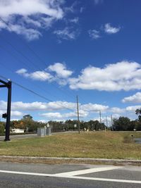 View of road against cloudy sky