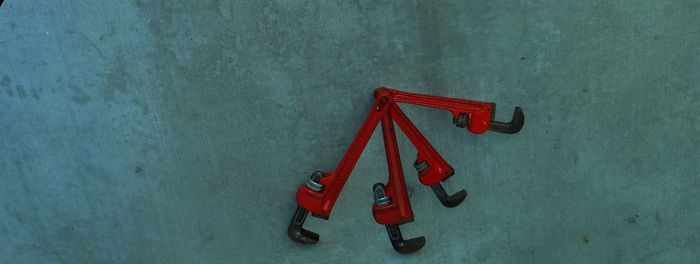 Panoramic view of adjustable wrenches hanging on wall