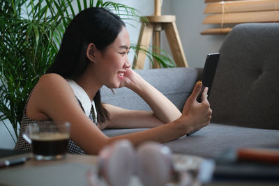 Young woman using mobile phone